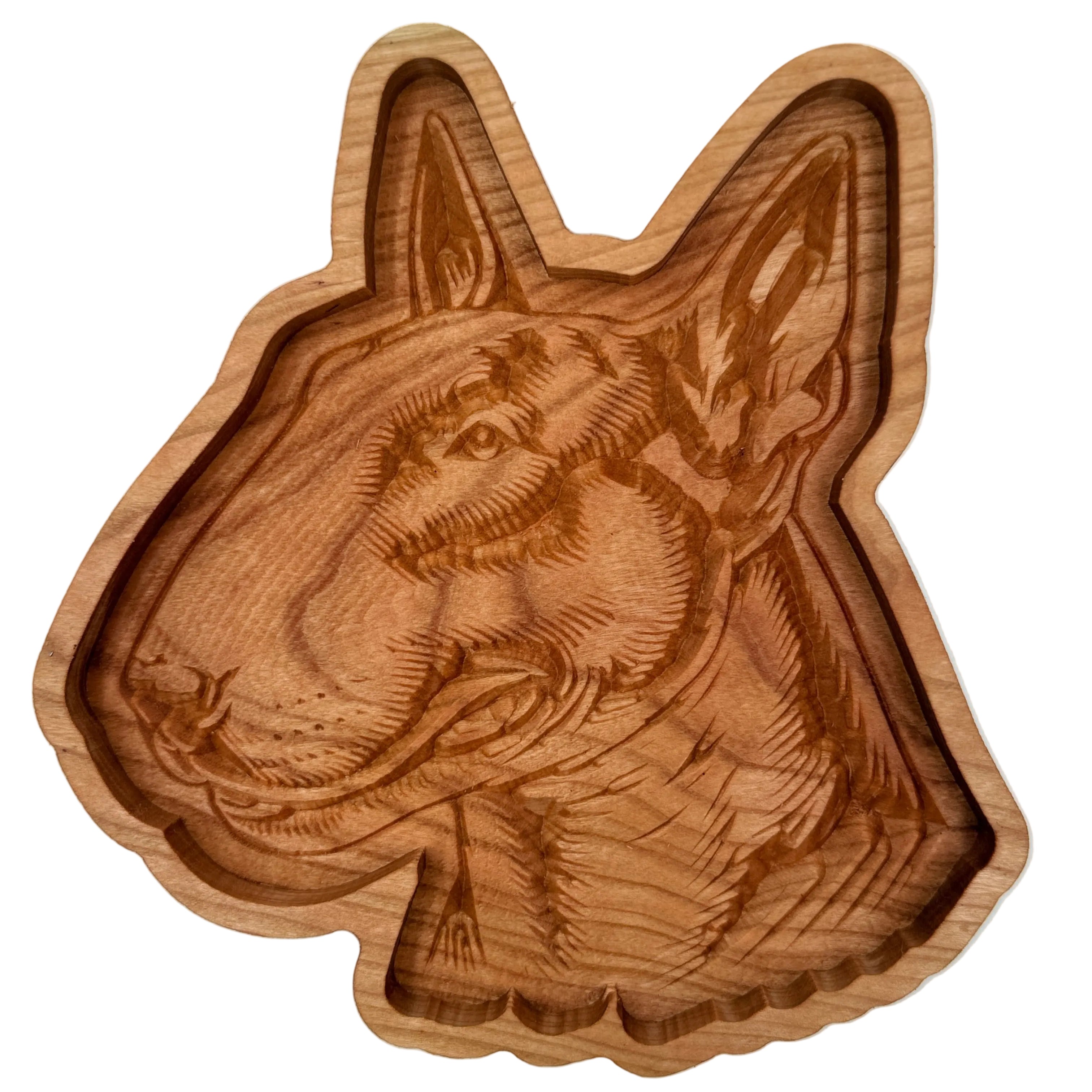A handcrafted wooden dog head tray with detailed carvings of a dog&