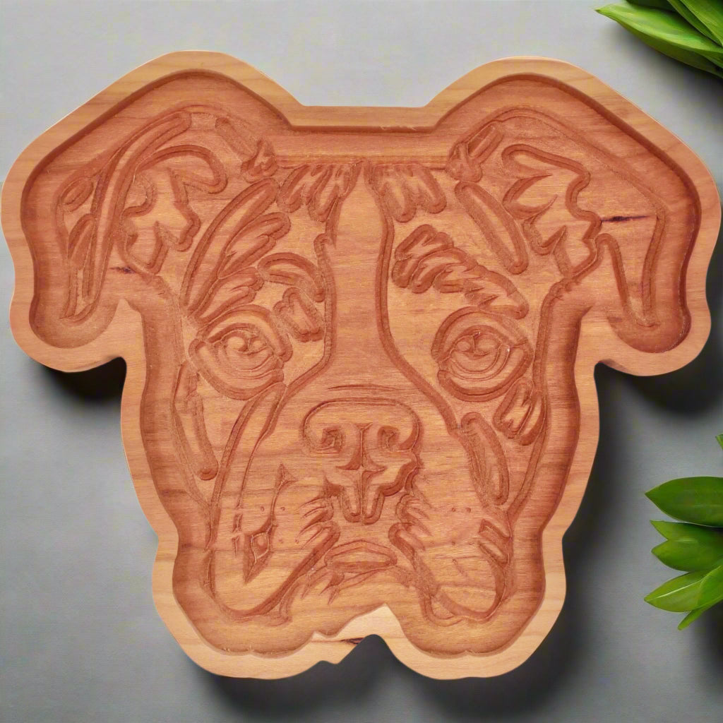 Wooden dog-shaped catch-all tray with a detailed dog face design on a white background