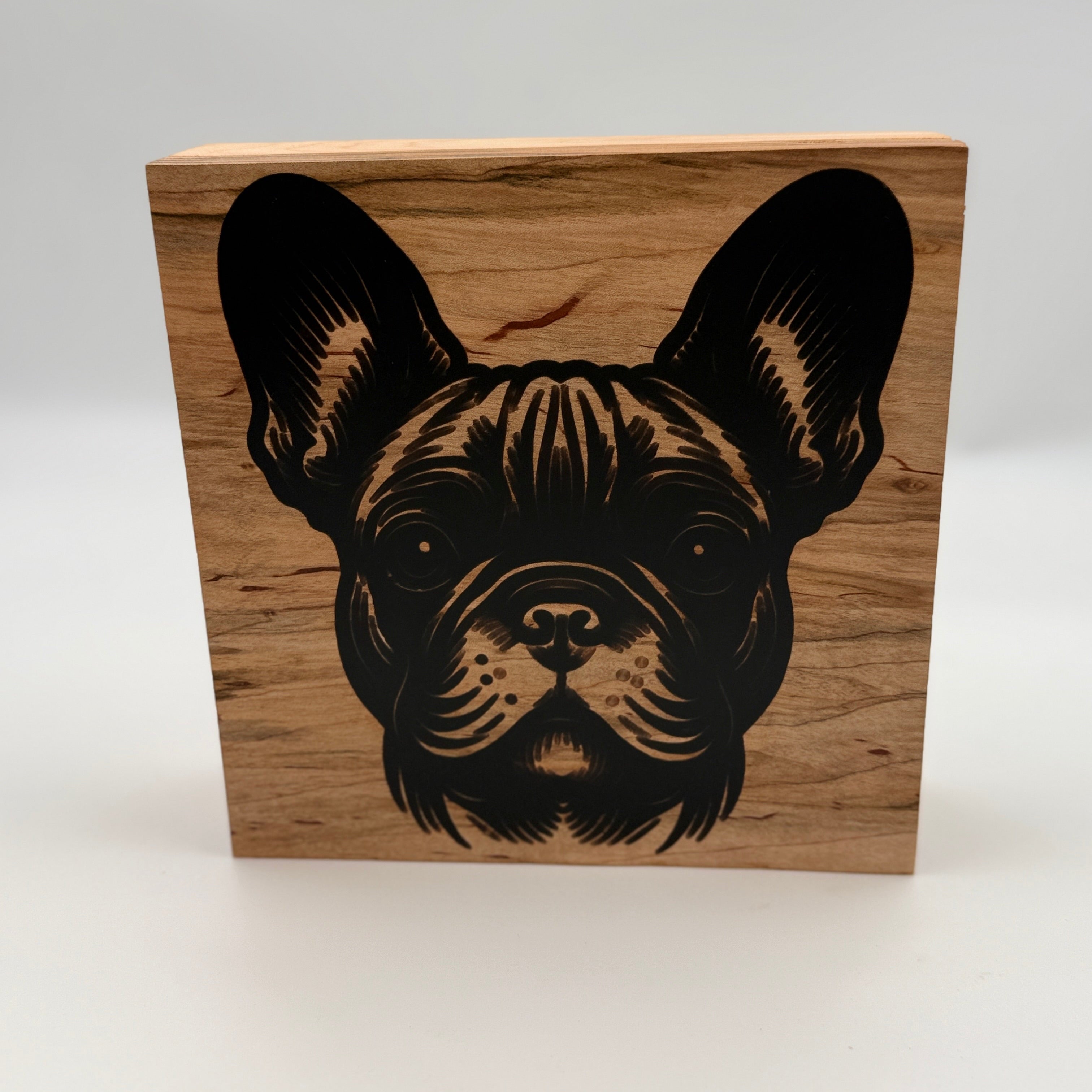 Wooden block with a laser-cut design of a dog&