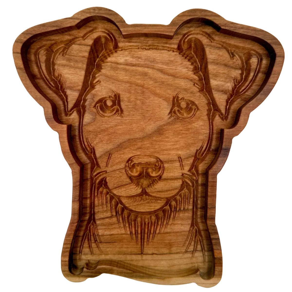 A carved wooden dog head serving tray or bowl, featuring detailed engravings of the dog&