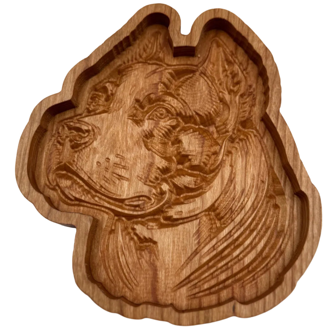 A handcrafted wooden dog-shaped tray with an engraved portrait of a dog on the inside, shown on a plain white background.