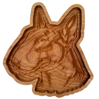 A handcrafted wooden dog head tray with detailed carvings of a dog&