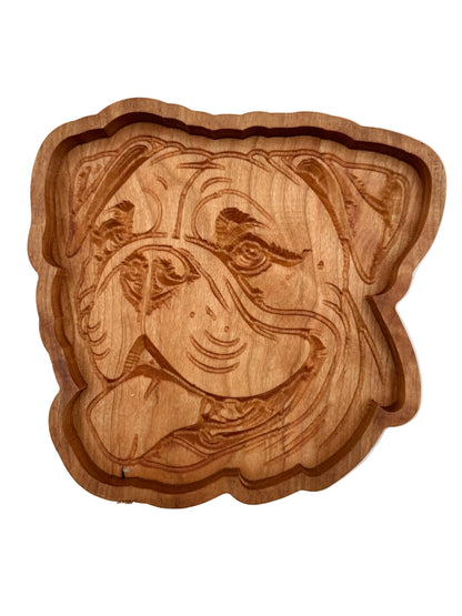 A hand-carved wooden serving tray shaped like a bulldog&