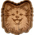 A hand-carved wooden dog face tray with a scalloped edge, shown on a plain white background.