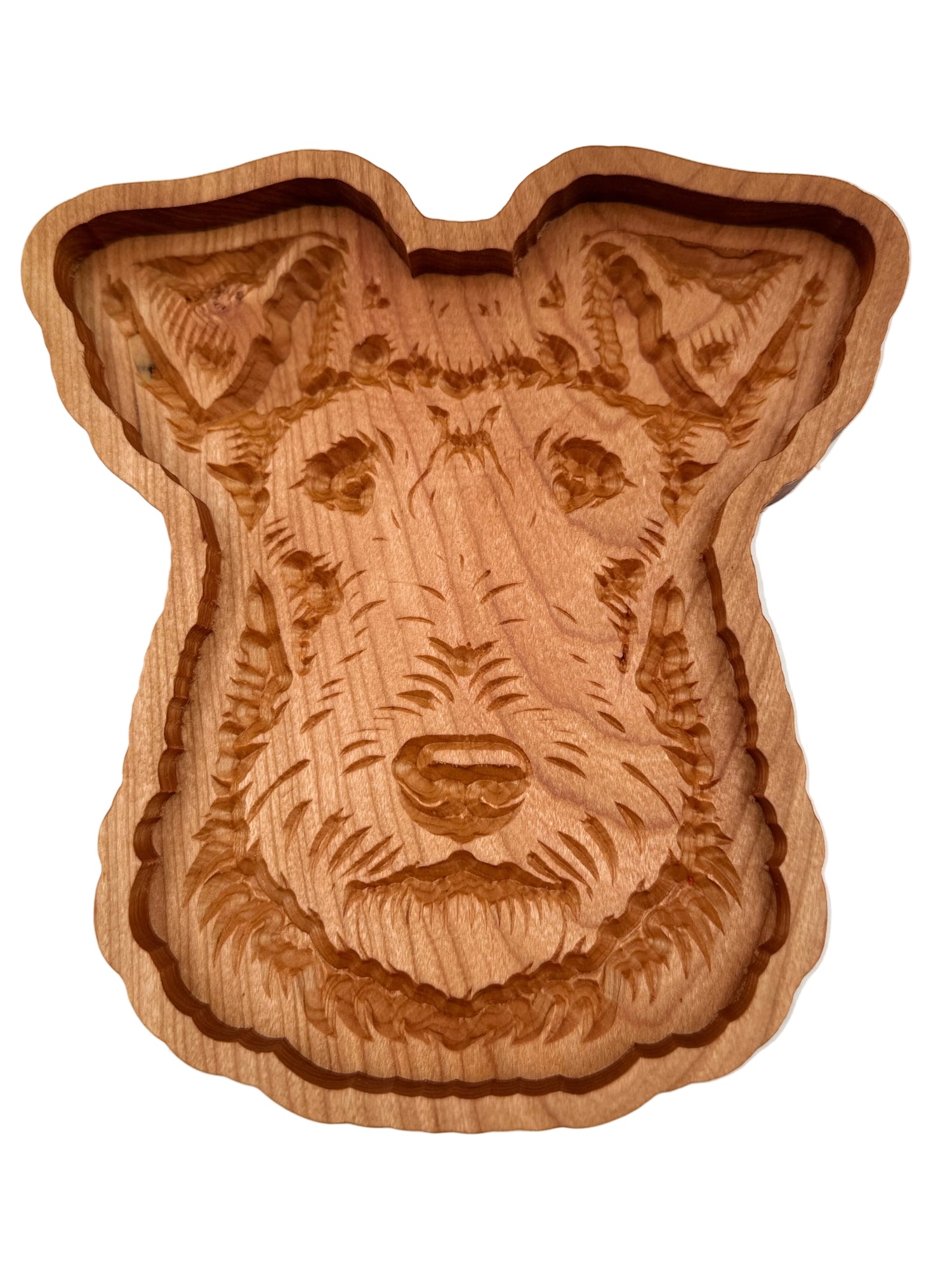 A hand-carved wooden dog head plaque or tray, showcasing detailed wood grain and engravings, set against a plain white background.