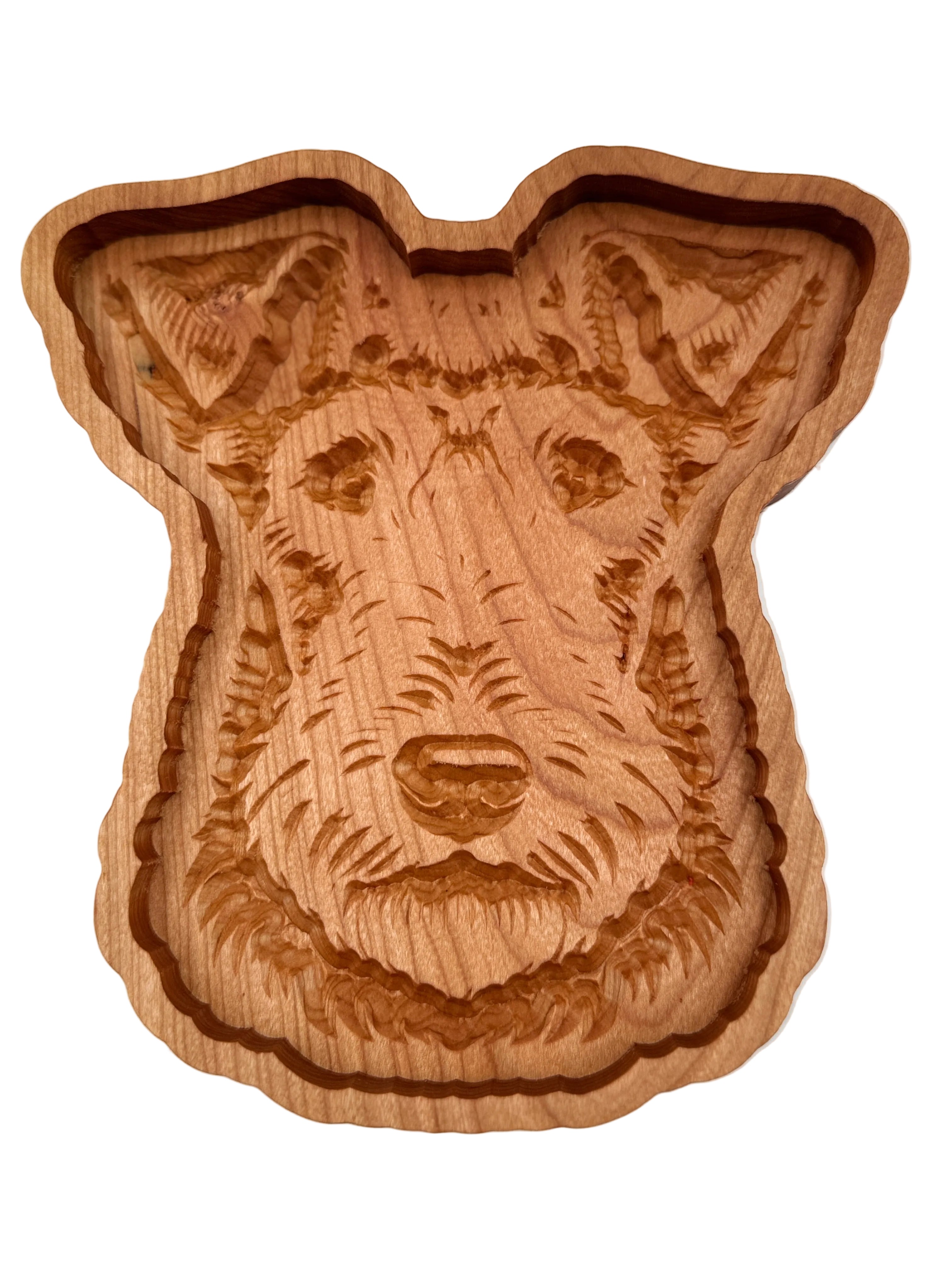 A hand-carved wooden dog head plaque or tray, showcasing detailed wood grain and engravings, set against a plain white background.