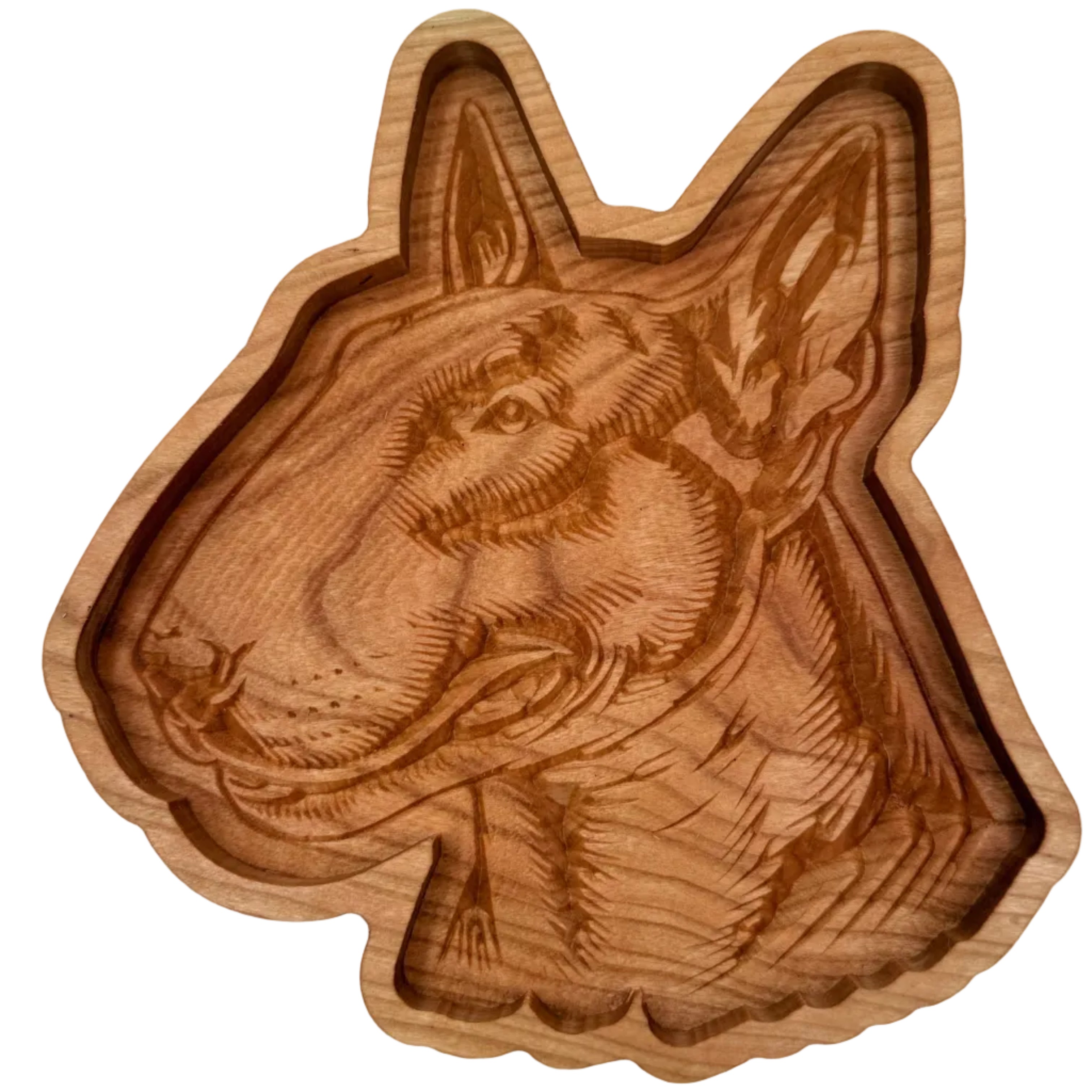 A carved wooden dog head tray with detailed engravings of the dog&