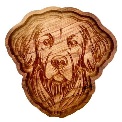 A scalloped wooden serving tray shaped like a dog&
