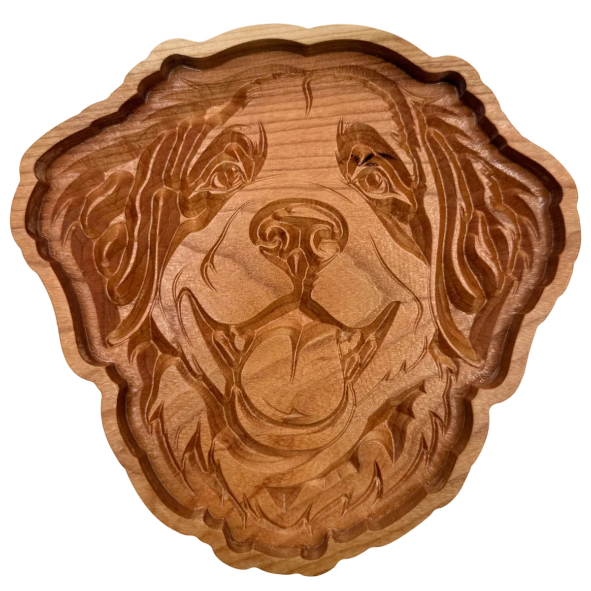 A hand-carved wooden dog head plaque or tray, showcasing detailed wood grain and natural brown tones, set against a plain off-white background.