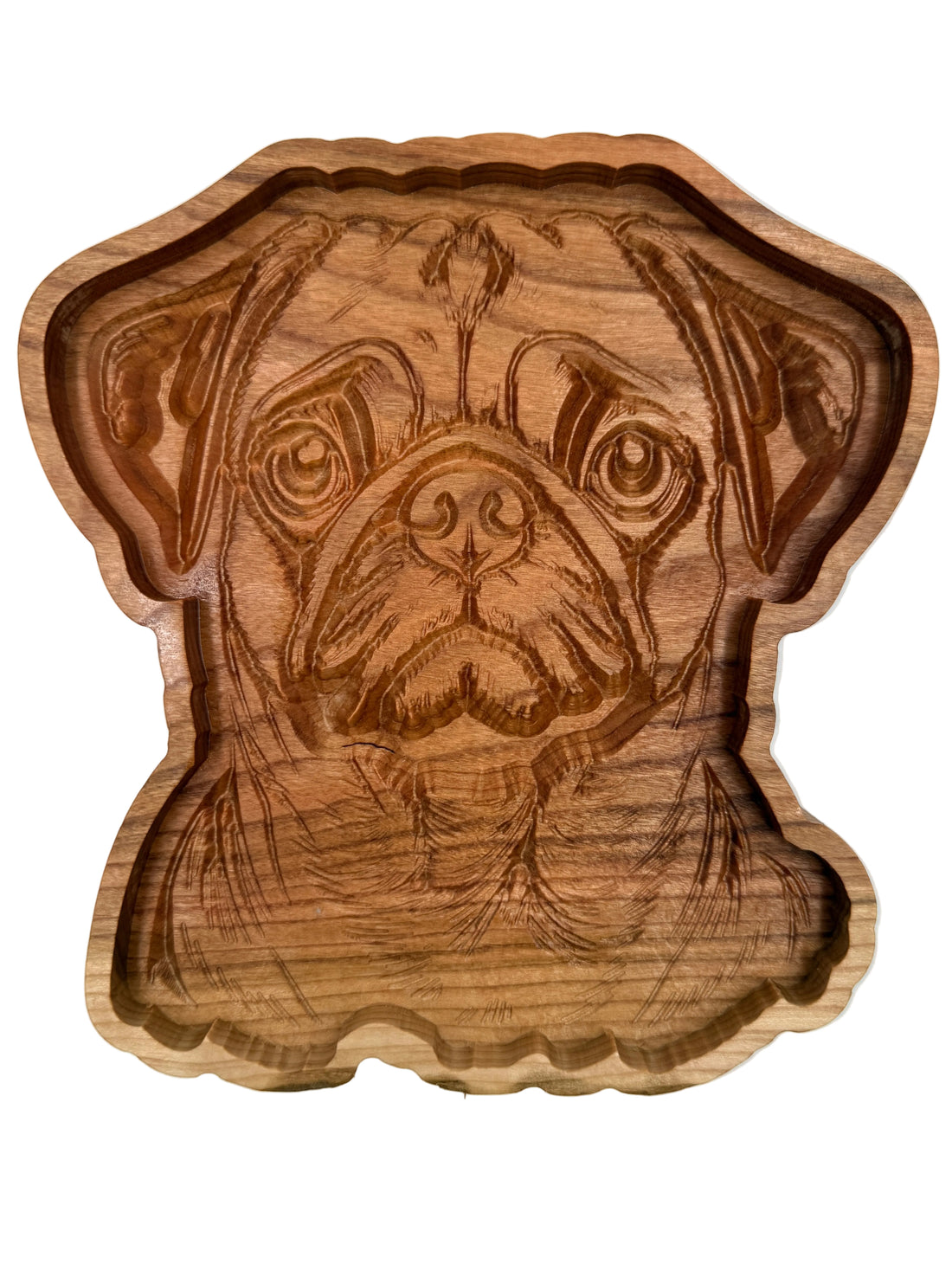 A hand-carved wooden dog head tray or bowl with detailed engraving of a pug&