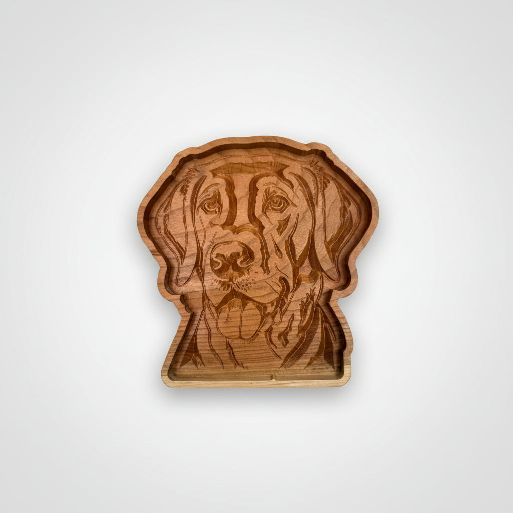 A handcrafted wooden dog head tray with an engraved portrait of a dog, shown on a plain white background.