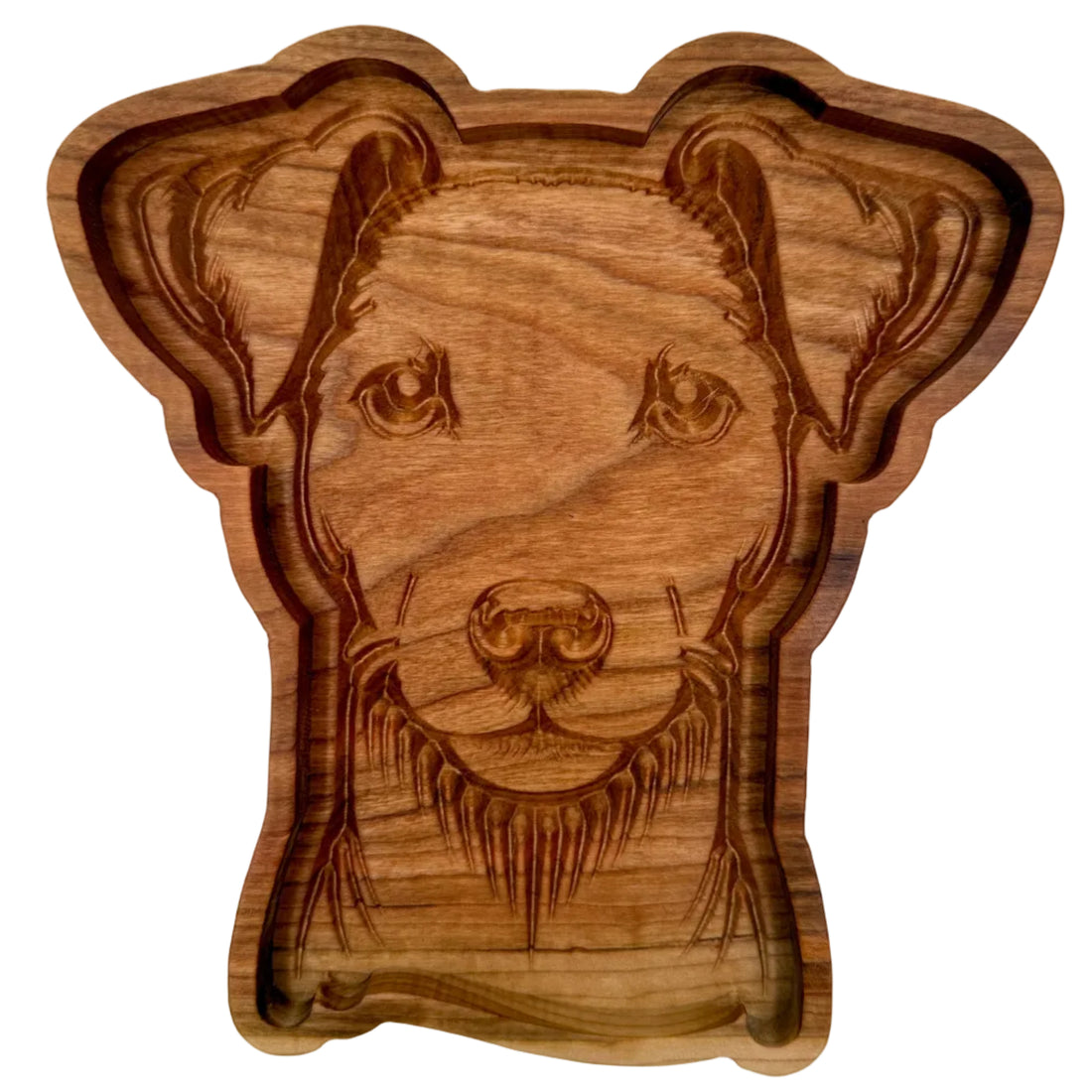 A carved wooden dog head serving tray or bowl, featuring detailed engravings of the dog&