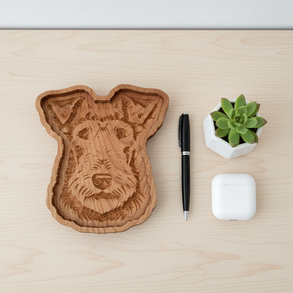 Overhead flat lay of Airedale Terrier catch-all tray with pen, succulent, and AirPods on desk